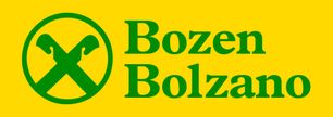 Green logo with crossed scythes inside a circle, next to "Bozen Bolzano" text on a yellow background.