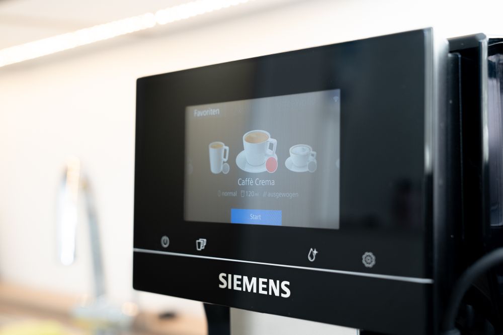 Our coffee machine. The display shows "Caffè Crema" is selected.