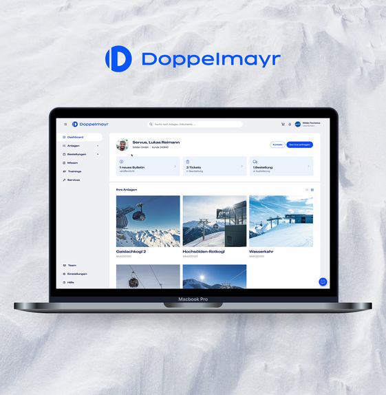 Laptop displaying a Doppelmayr prototyping example, set against a snow surface background with the Doppelmayr logo.