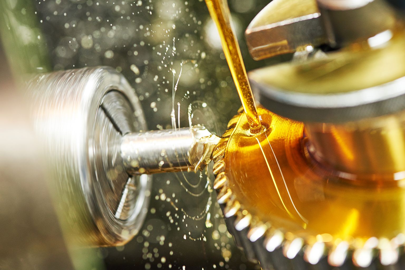 A metal gear and drill bit with amber fluid