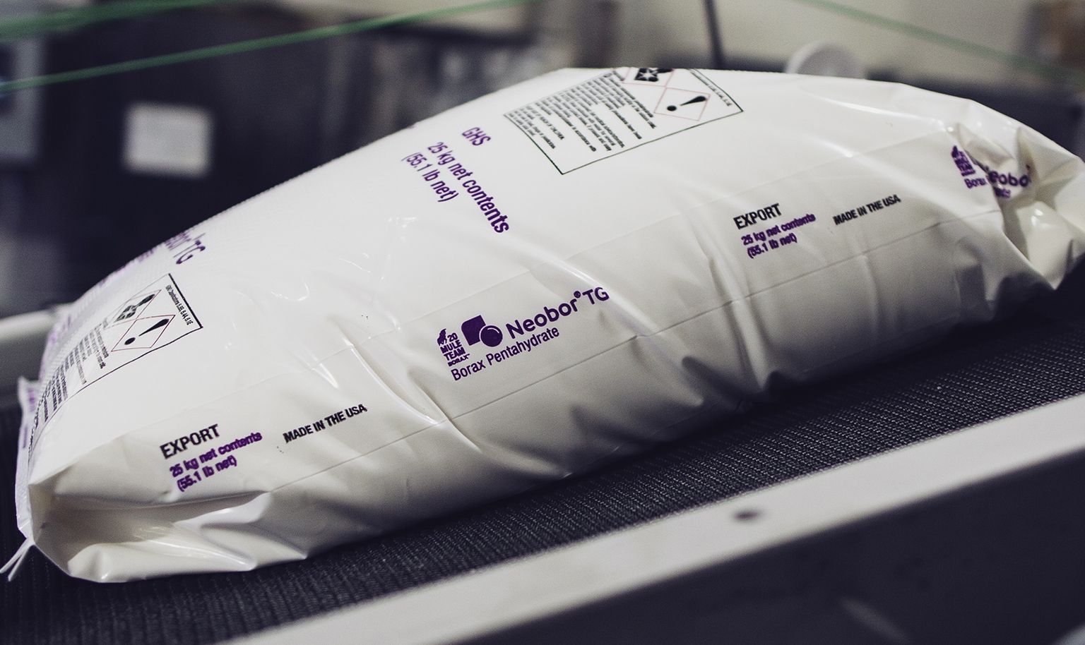 Bag of U.S. Borax Neobor TG borax pentahydrate on a conveyor belt