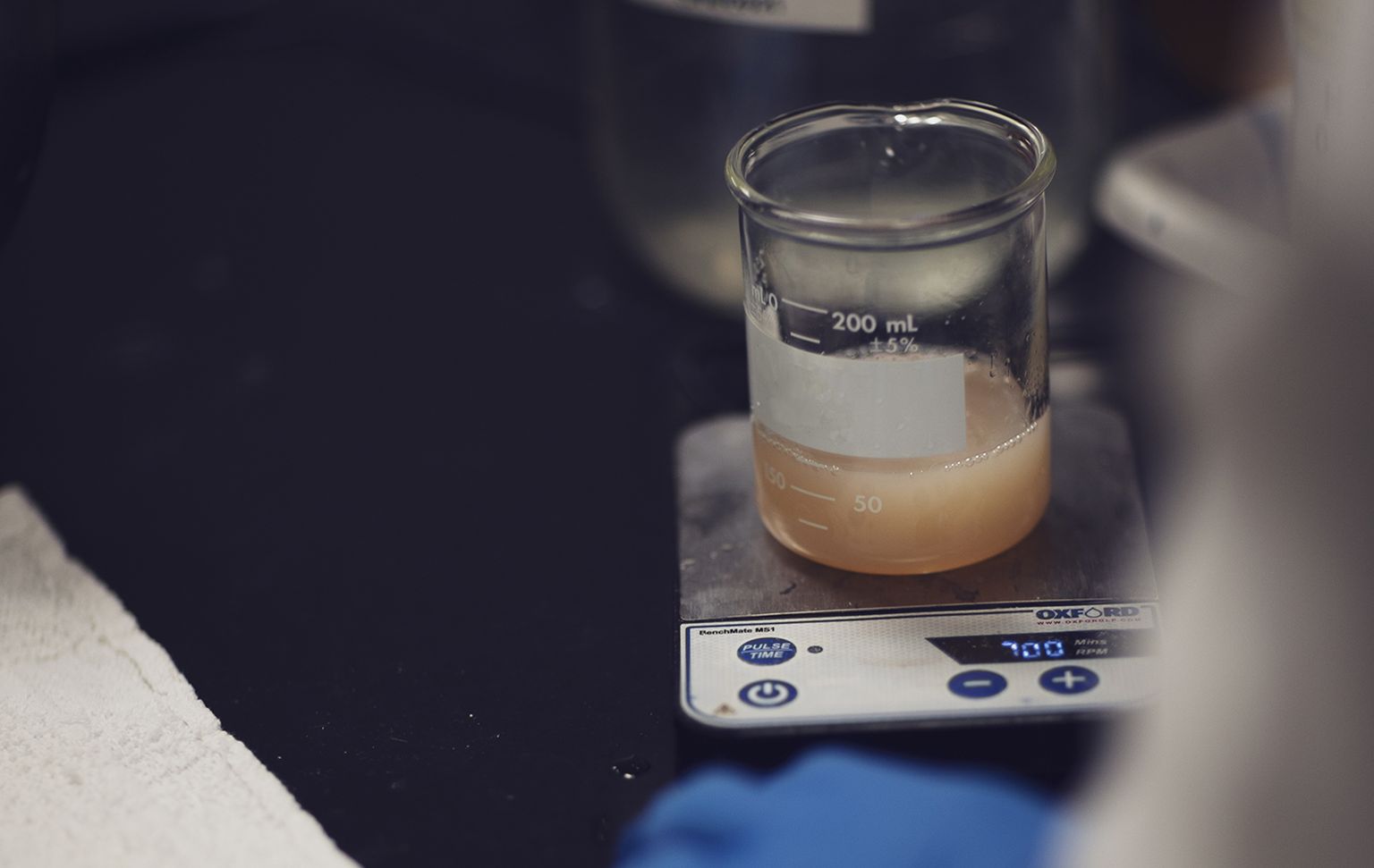 Beaker with fluid in it on a scale in the Boron Operations laboratory