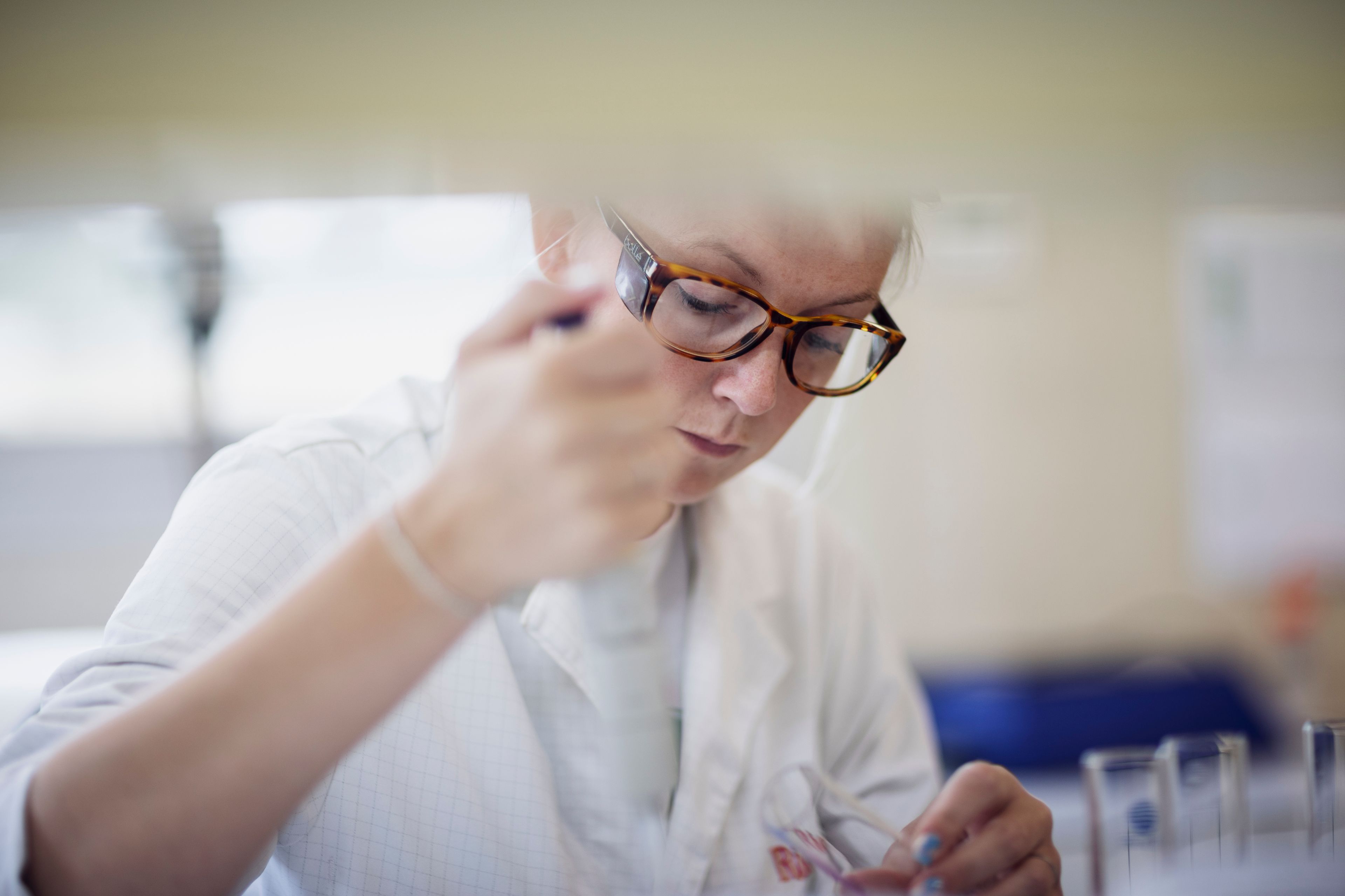Scientist with a pipette