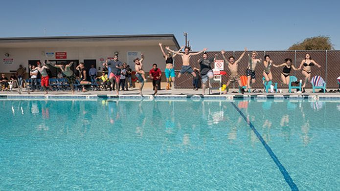 Partnering with school district to restore and reopen community swimming pool