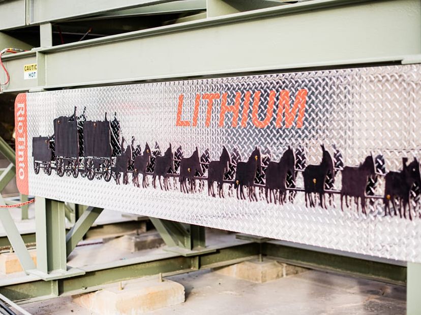 Lithium signage above horse drawn carriage.