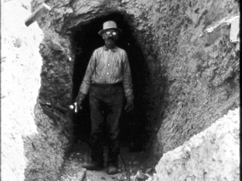 Miner in entrance to mine in 1925