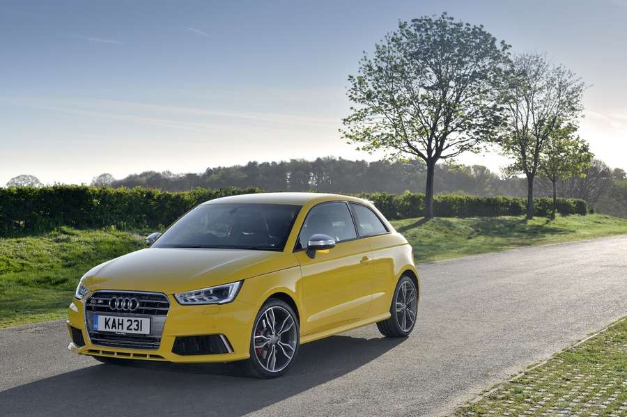 A yellow Audi S1 hatchback