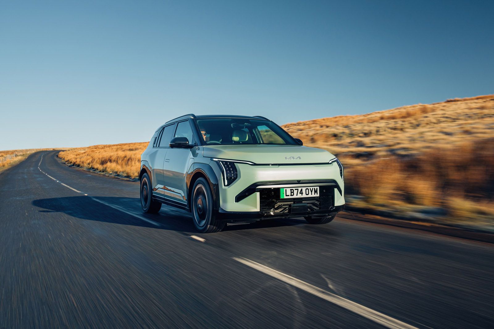 Kia EV3 driving on a country road