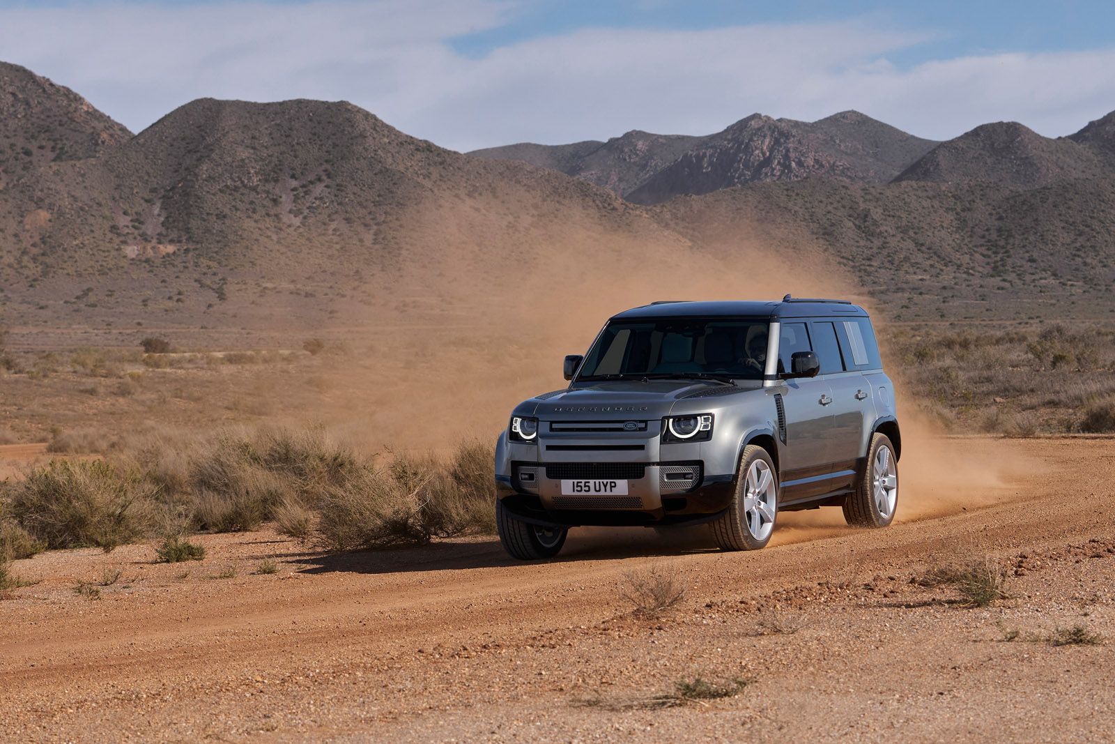 Defender 110 driving on sand