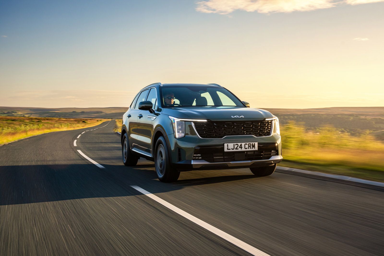 Kia Sorento driving on a country road