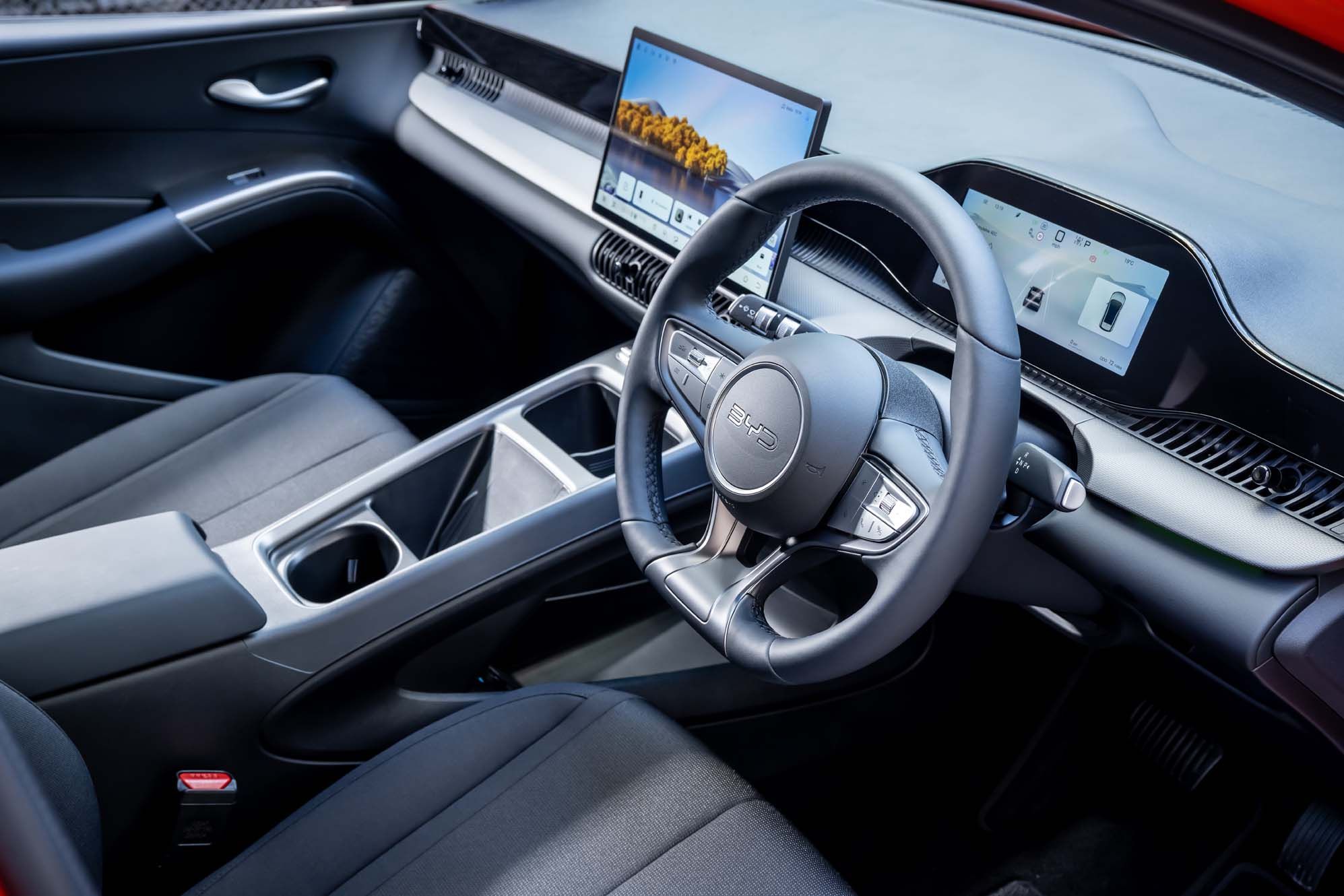 BYD DOLPHIN G DM-i interior with a digital dashboard, touchscreen display, and a sleek steering wheel.