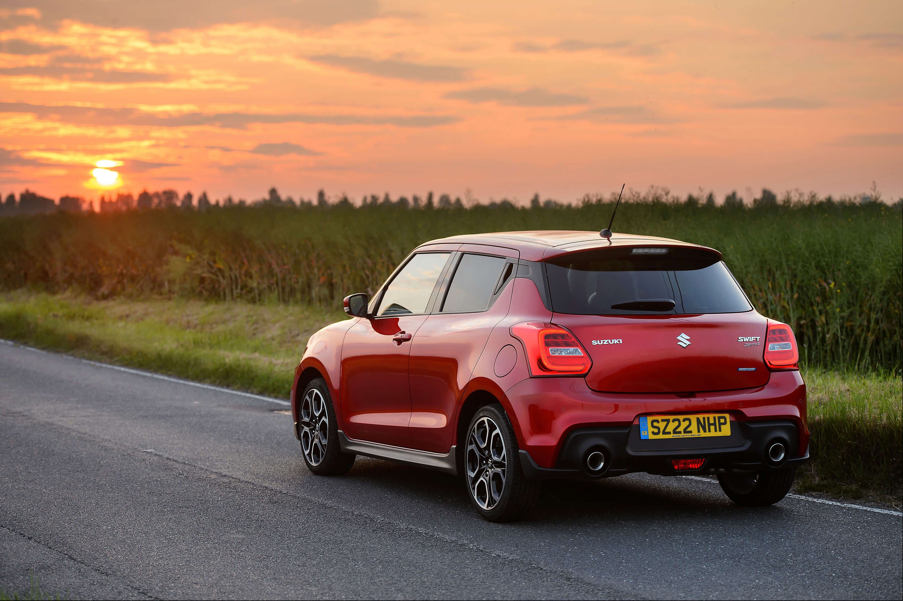 A red hybrid Suzuki Swift Sport