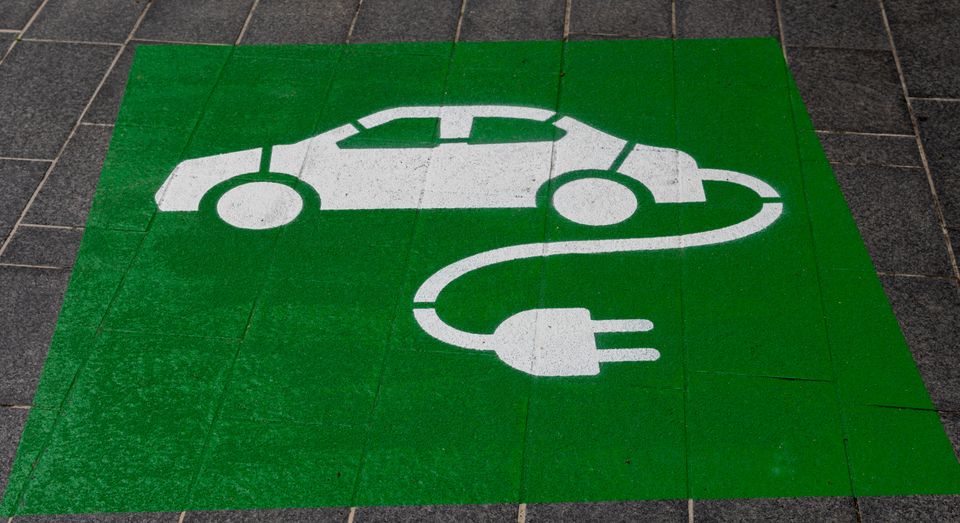An image of an electric car parking sign painted on the floor