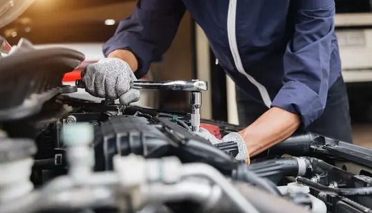 Mechanic servicing car