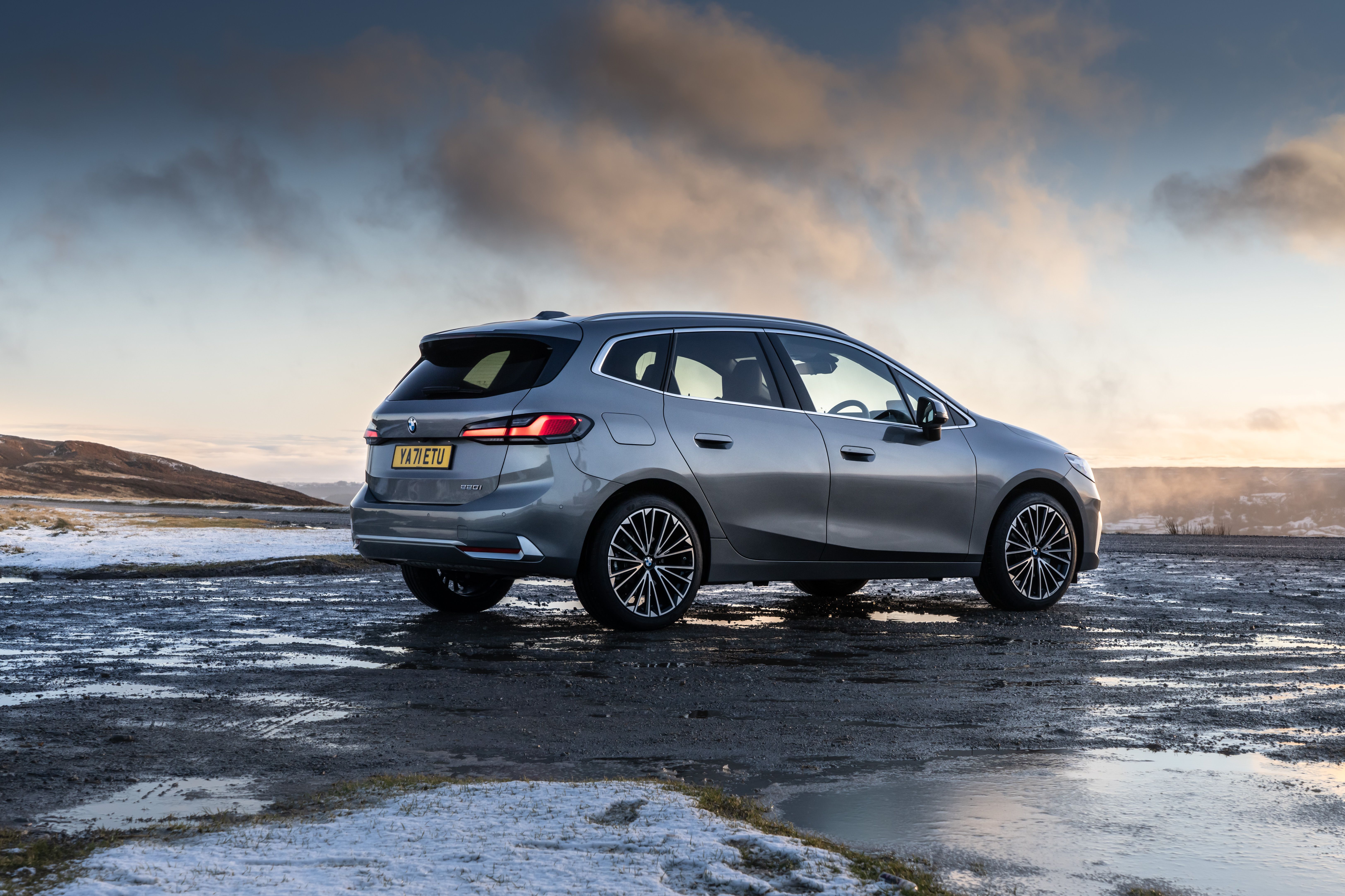 A grey BMW 2 Series Active Tourer parked next to the sea