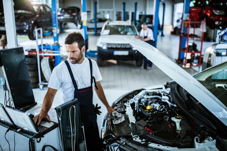 Mechanic performing car service