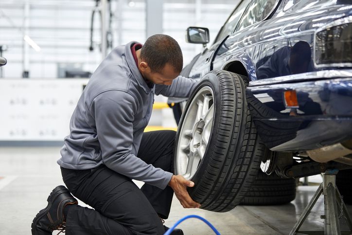 Mechanic fixing tyre