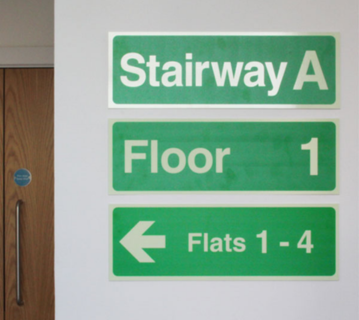 Wayfinding Signs On Wall: Stairway A, Floor 1, Left Arrow Flats 1 - 4