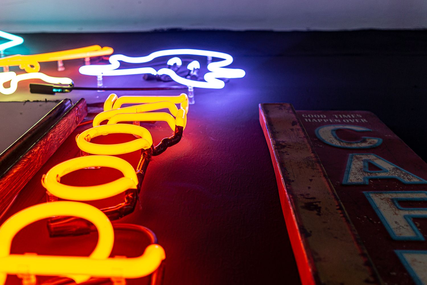 Glowing neons in a corner of Jaison's studio.