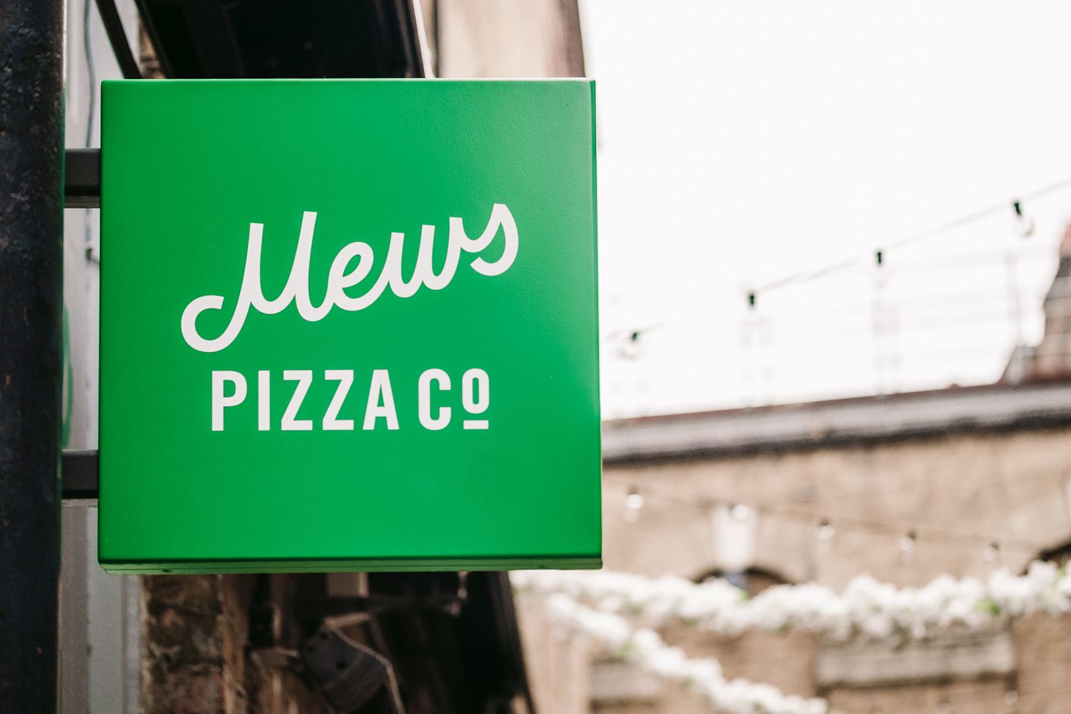 A bright green outdoor sign.