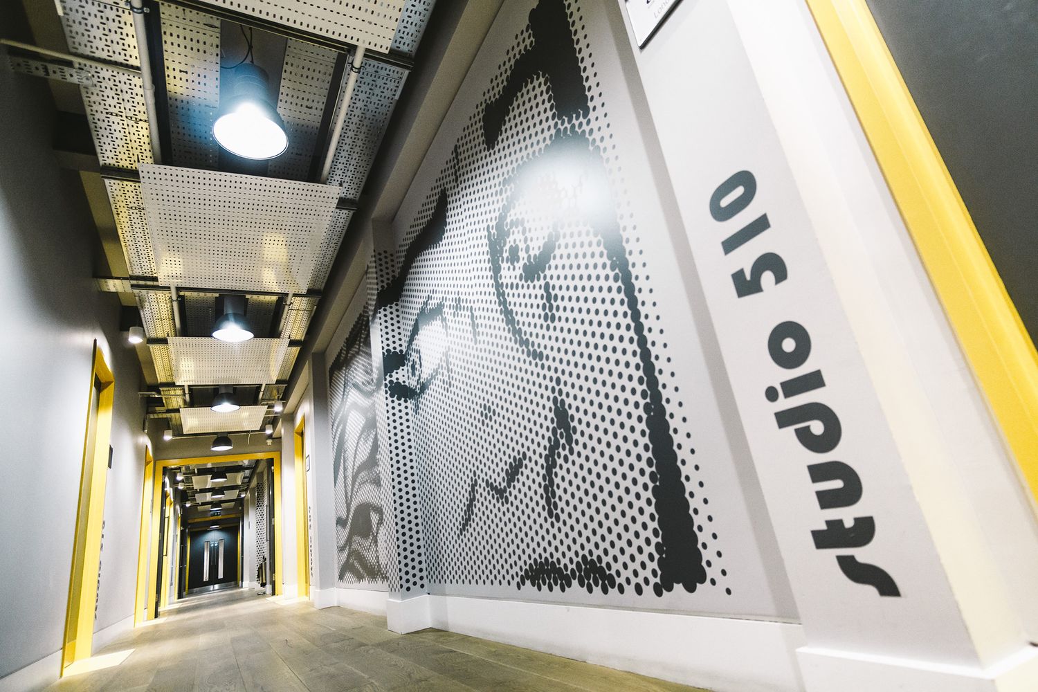 Giant black and white comic book vinyl wall applied from floor to ceiling