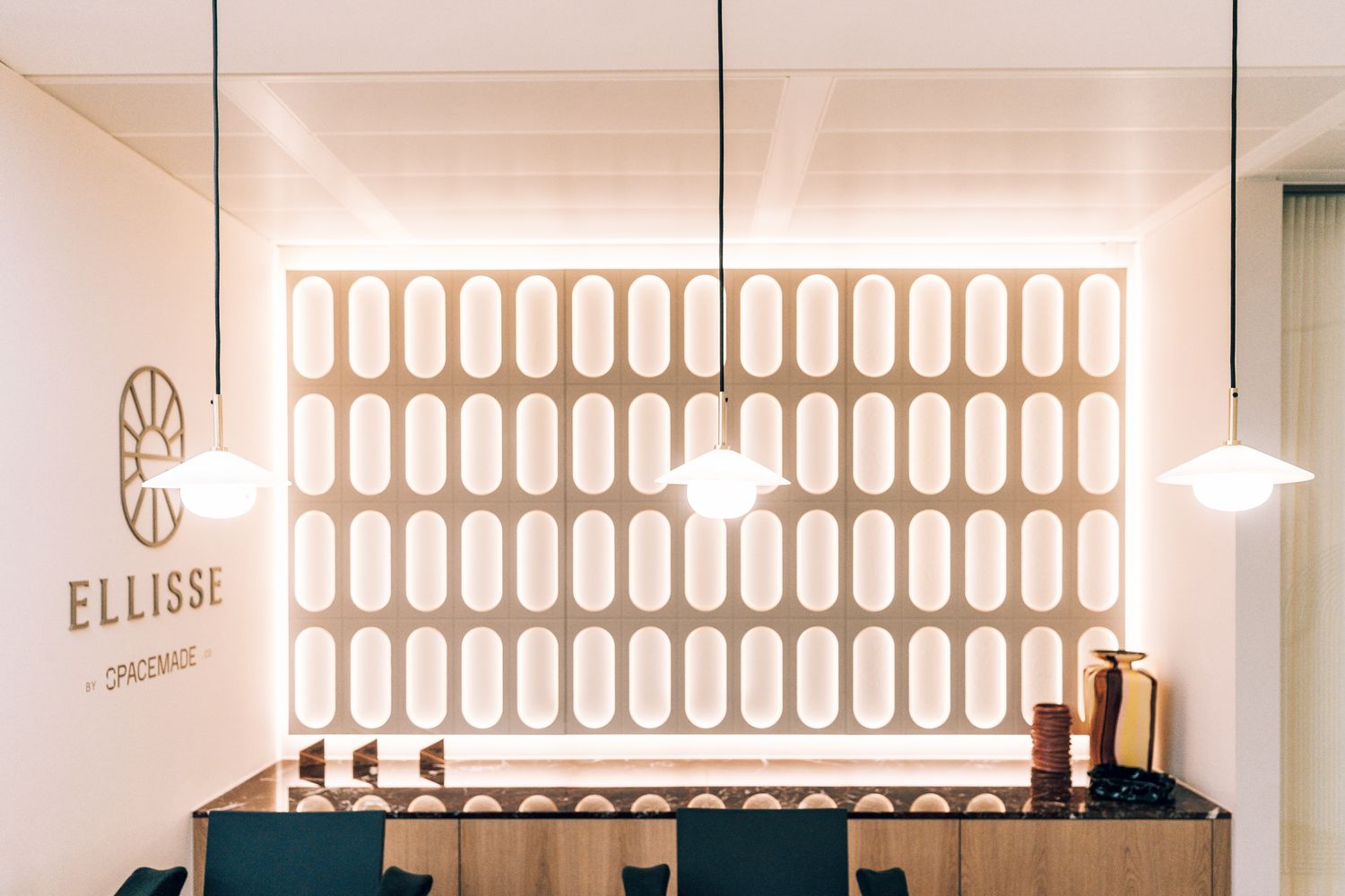 Ellisse by Spacemade reception with bespoke metal logo signage and illuminated Art Deco feature wall at 10 St Bride Street.