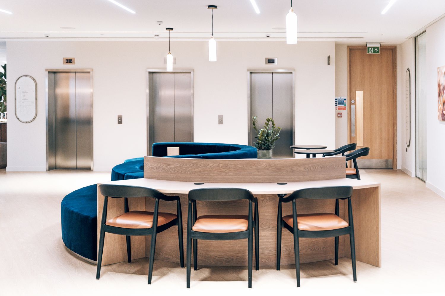Ellisse coworking interior with bespoke office signage and wayfinding positioned around the lift lobby and circulation space.