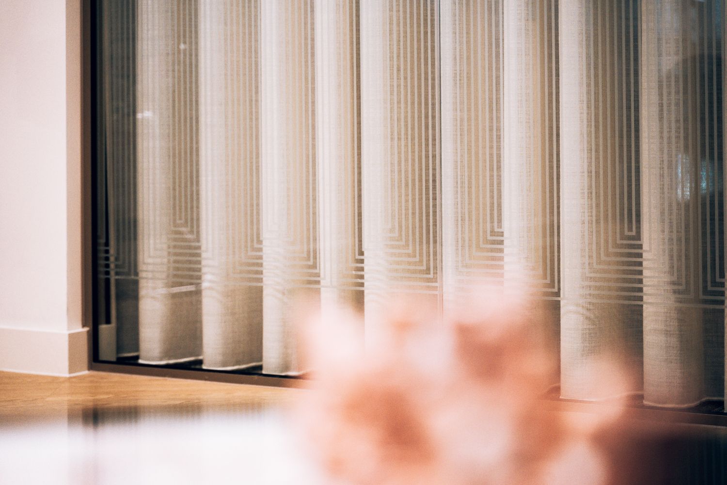 Branded glass manifestation at Ellisse by Spacemade, creating a decorative privacy screen while retaining light through the office interior.