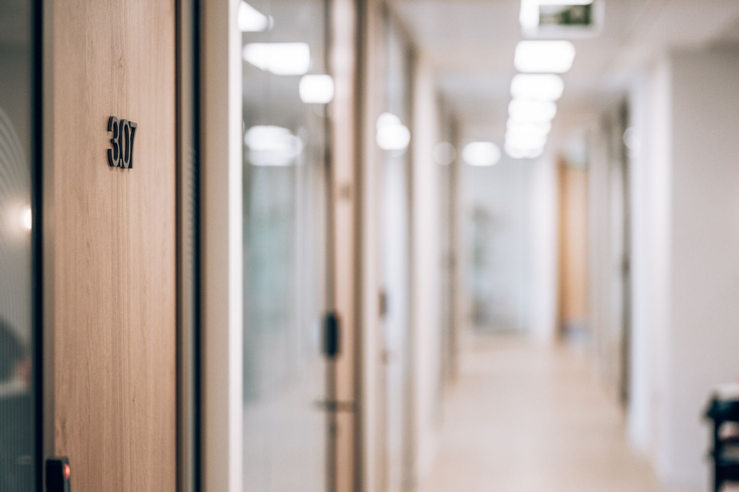 Bespoke 3D office door number at Ellisse by Spacemade, showing the workplace identification signage within the circulation space.