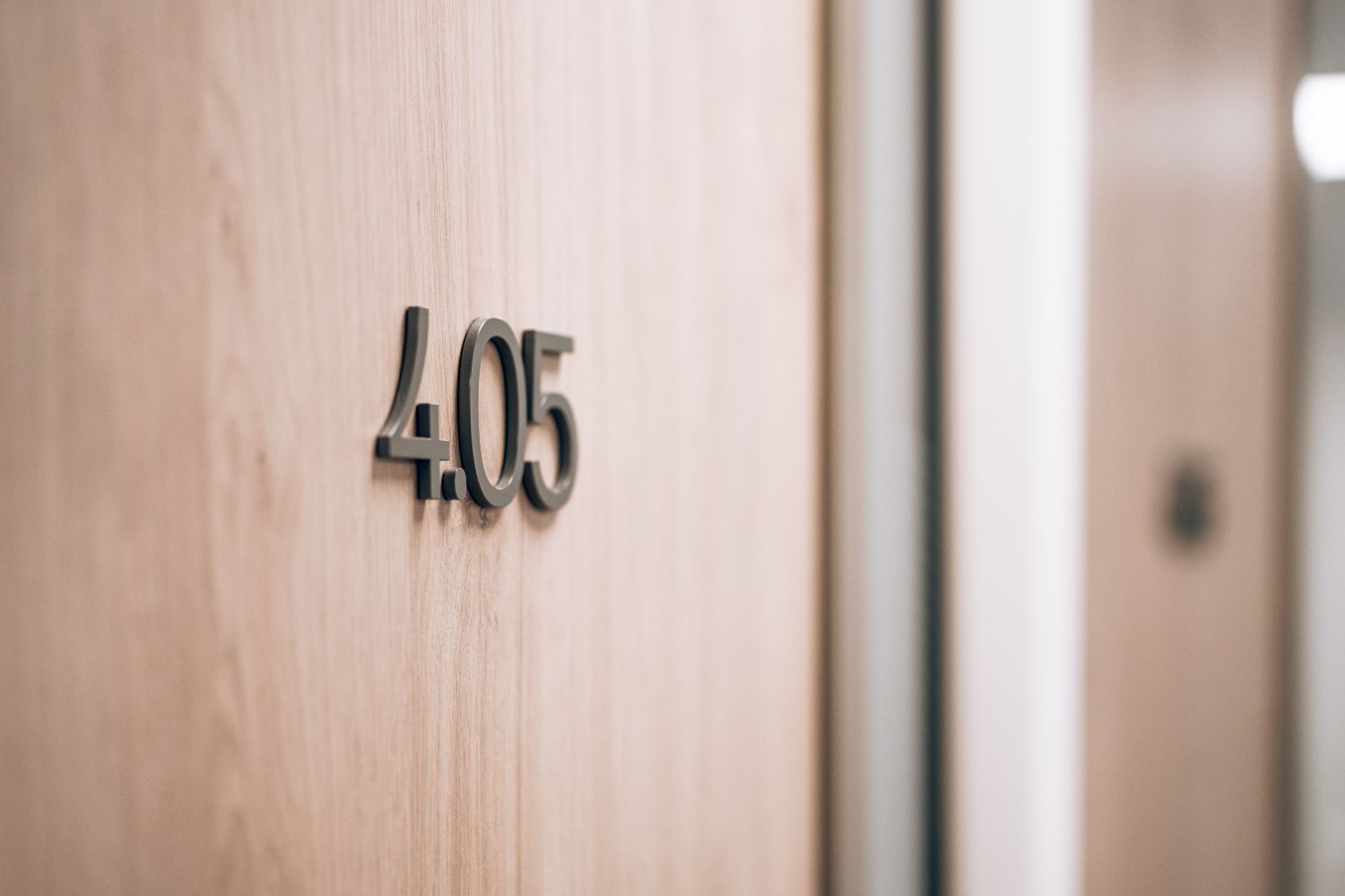 Bespoke office door number signage at Ellisse by Spacemade, part of the wider workplace wayfinding system.