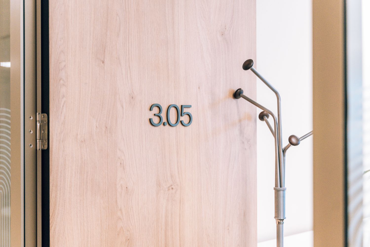 3D office door number 3.05 at Ellisse, integrated into the timber doors of the co-working interior.