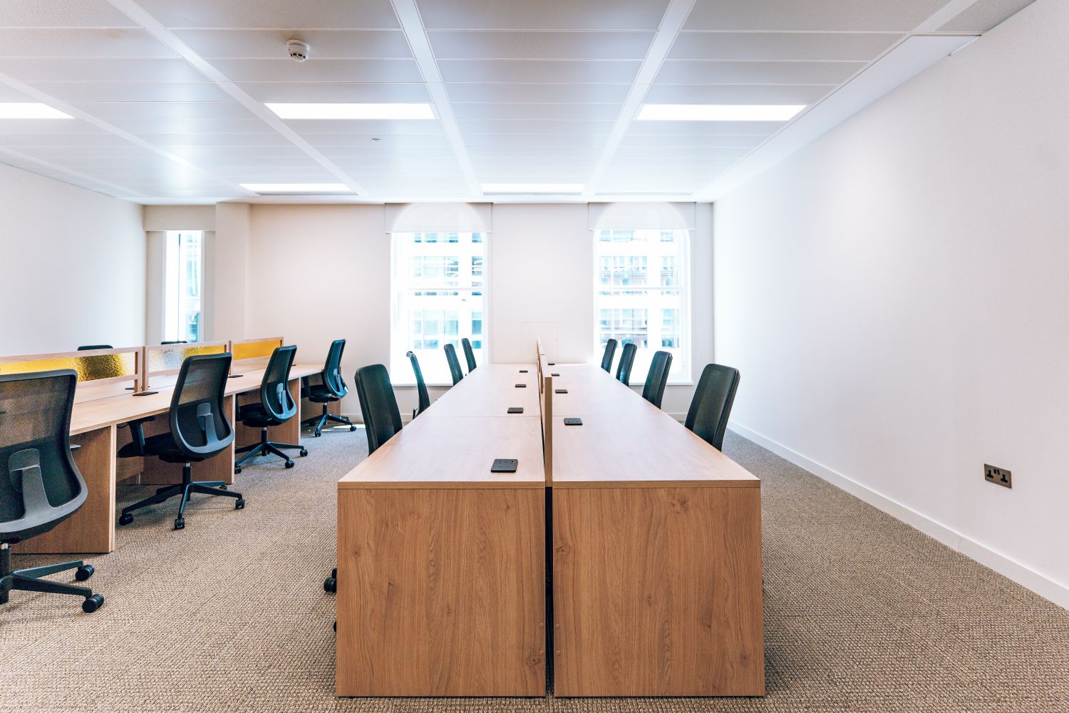 Ellisse by Spacemade coworking workspace with arched windows, showing the Art Deco inspiration behind signage system.