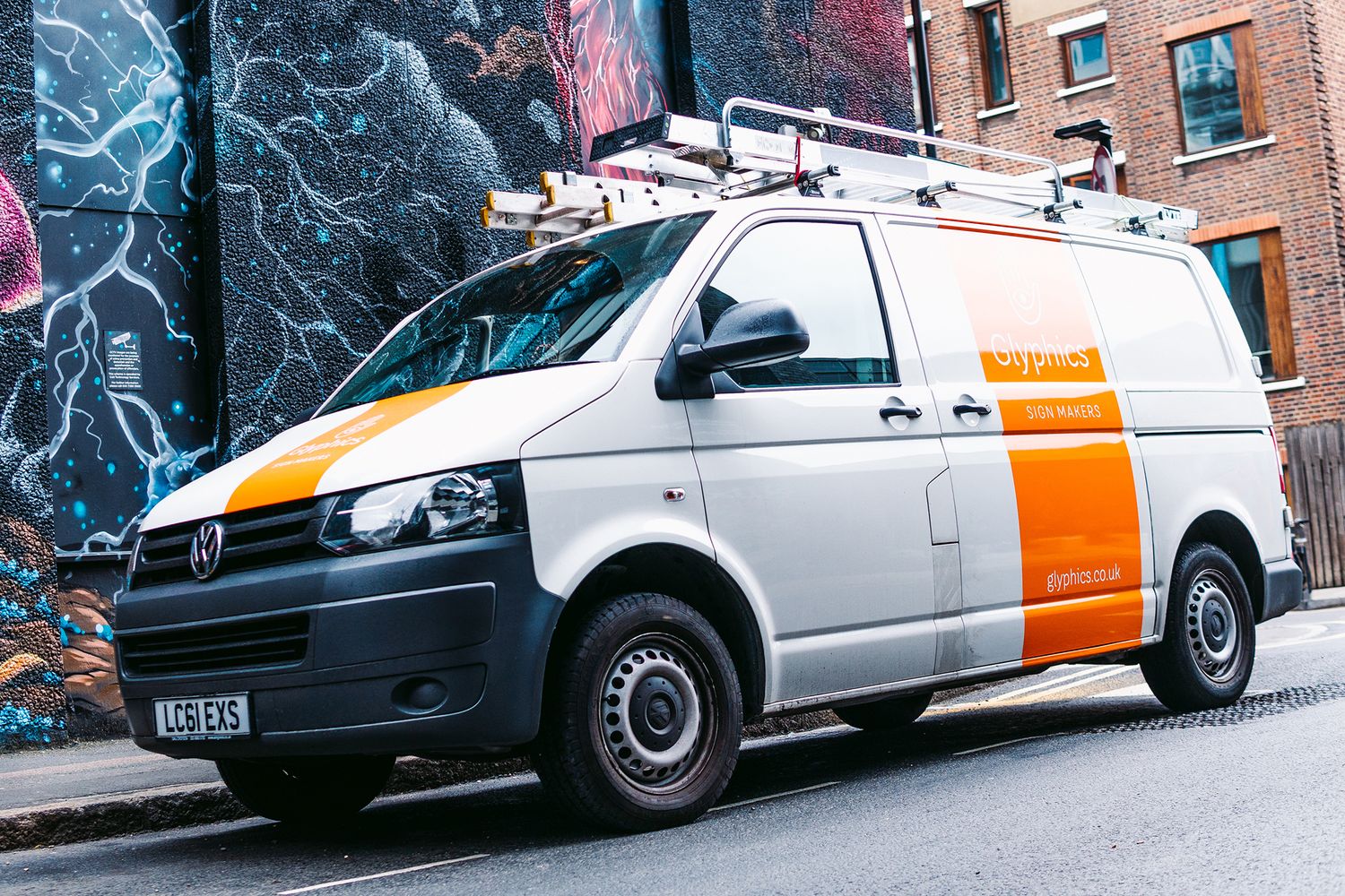 Glyphics van parked in a Shoreditch road with large mural