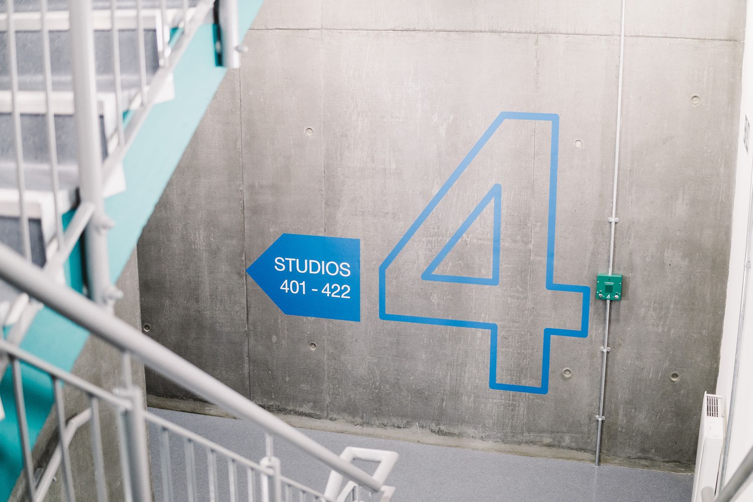 Bright blue vinyl lettering showing a huge 4 and and an arrow