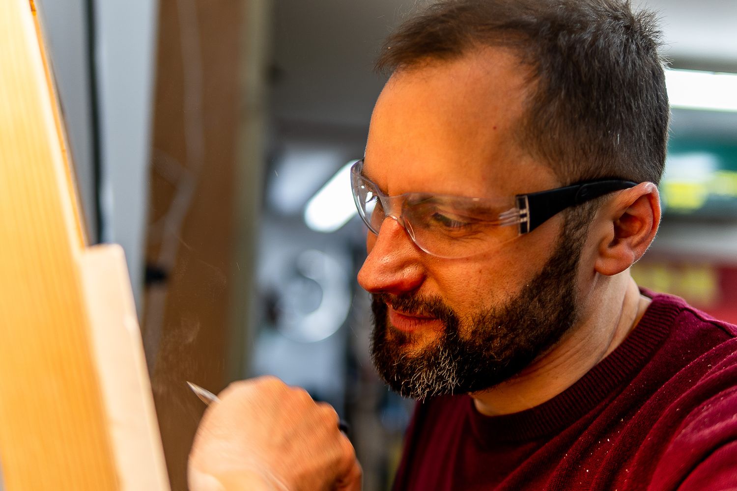 Tom Young with a stone carving chisel in hand.