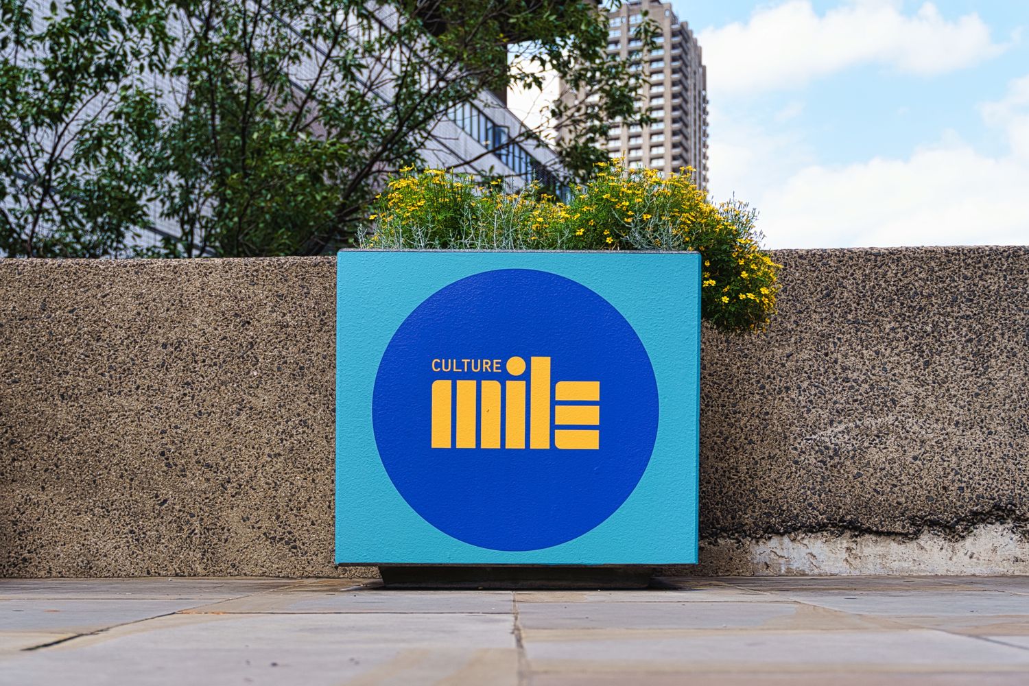 Vinyl graphic signage makes for flamboyant flowerpots on the London Wall, advertising the Culture Mile