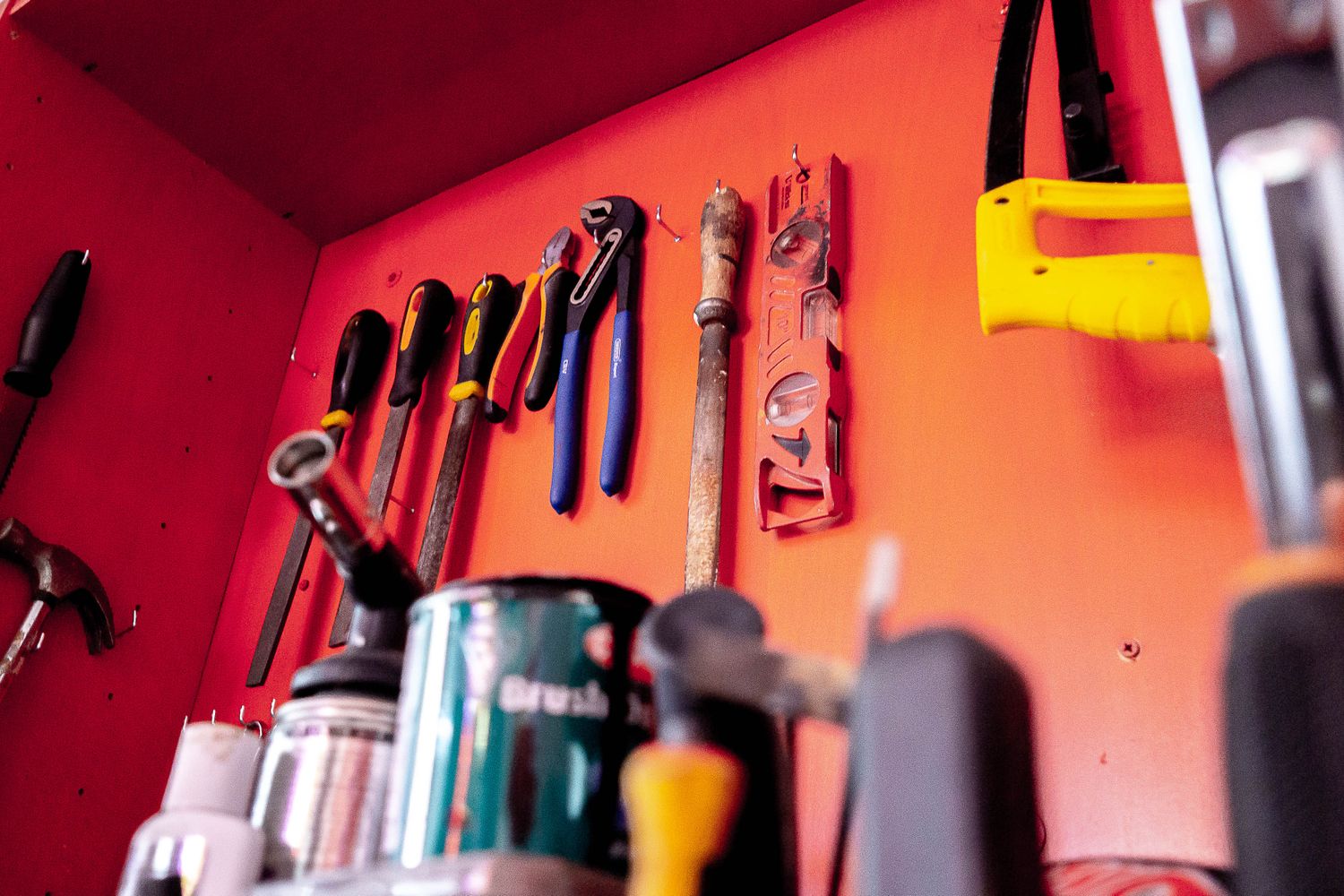 Red wall of tools in Jaison's studio.