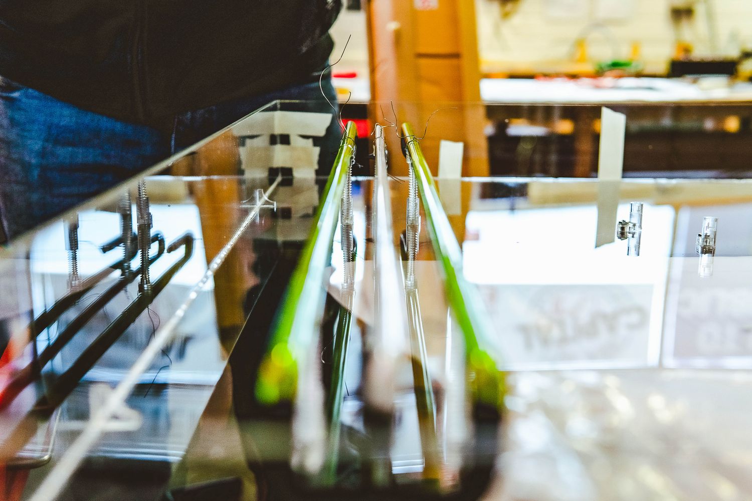 Two tubes of neon on the workbench.