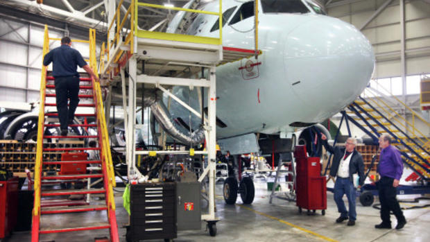 Technician working on aircraft