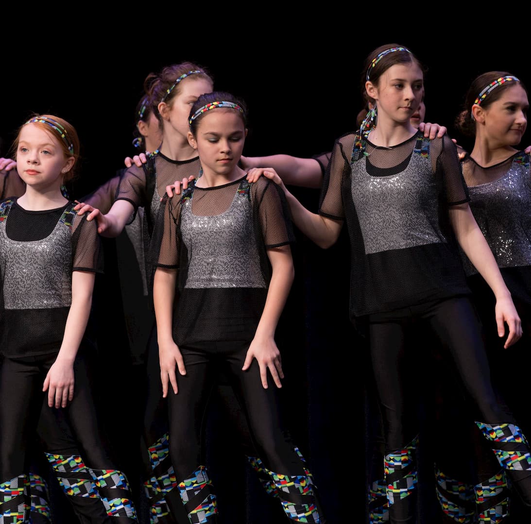 Jazz dancers performing across the floor