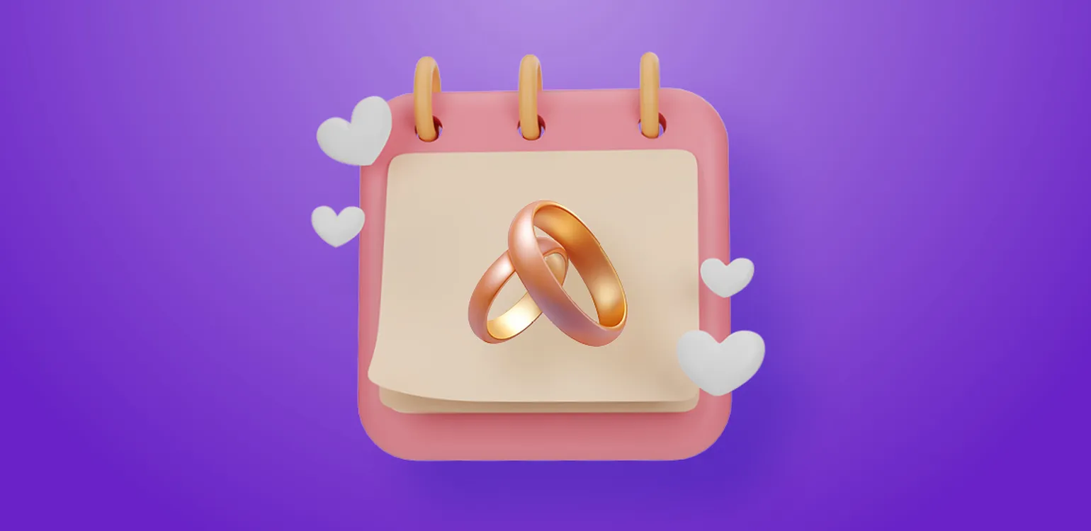 Wedding rings on a calendar surrounded by hearts