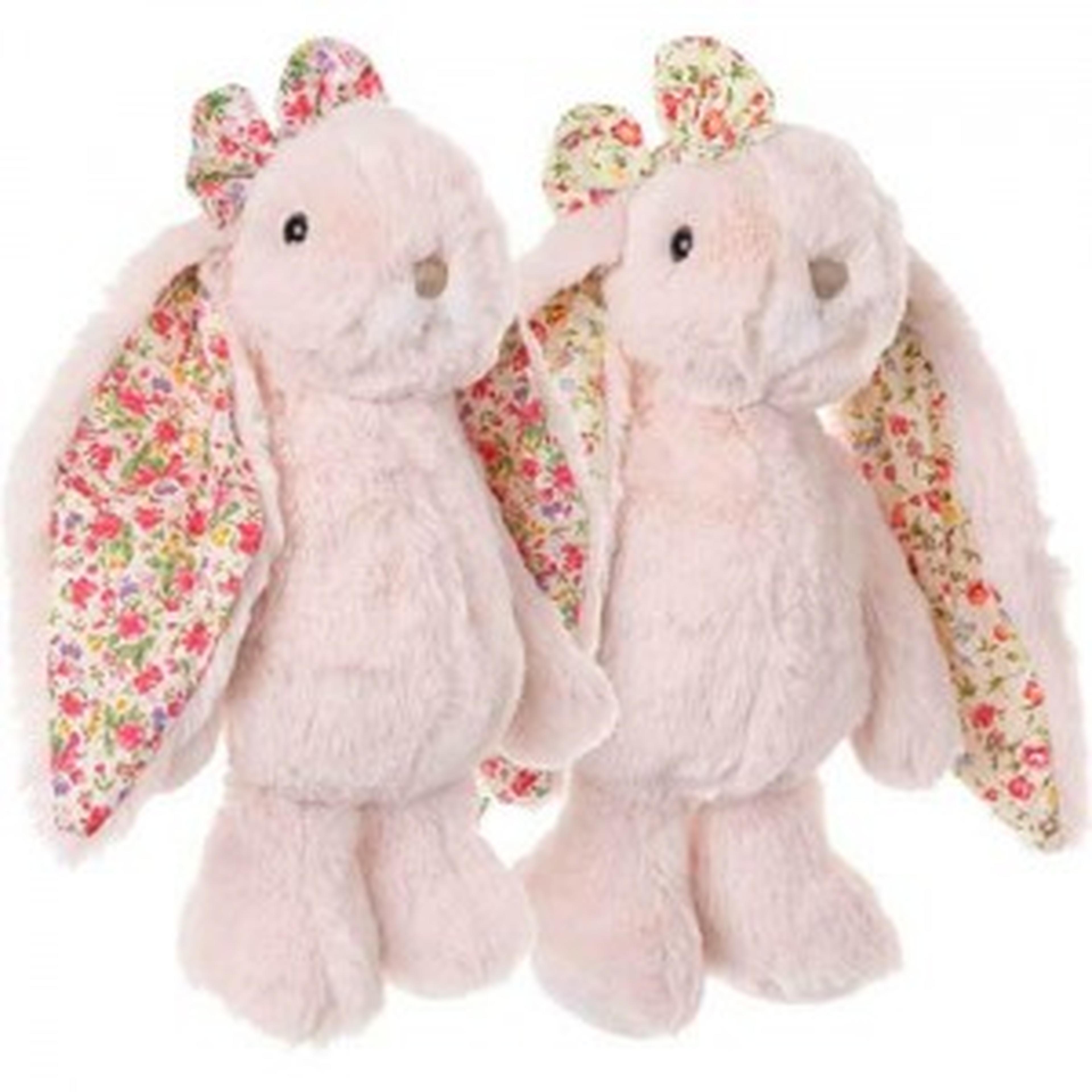 Two plush pink bunny toys with floral-patterned ears and matching bows, standing side by side.