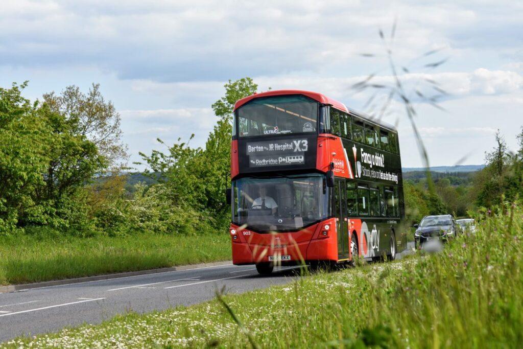 A red and black double-decker bus