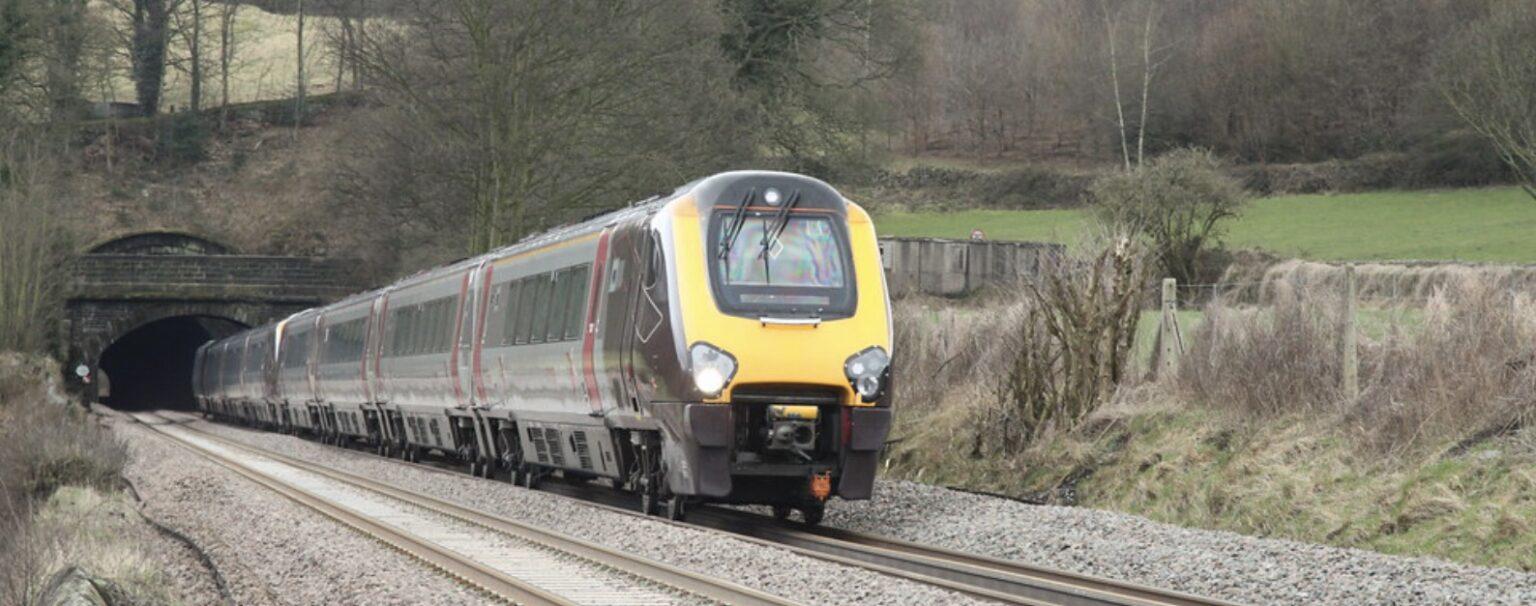 A high-speed train leaving a tunnel