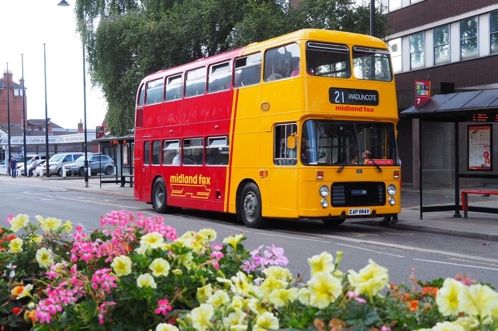 A red and yellow double-decker bus