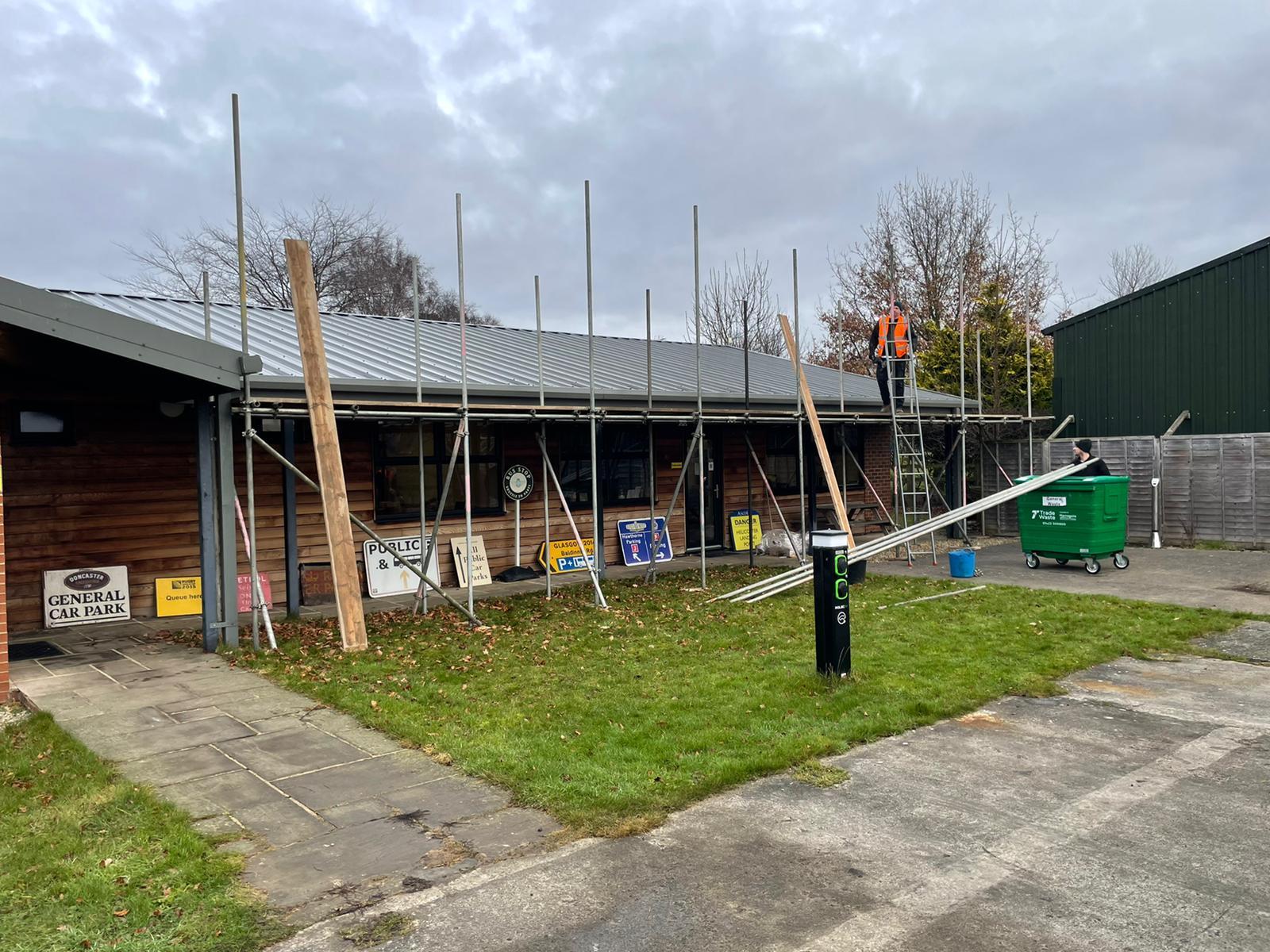 Workmen installing PV Solar panels.