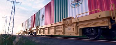 Train holding container cargo, with the Mexico national flag painted on.