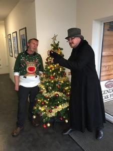 A person cosplaying as Ebeneezer Scrooge