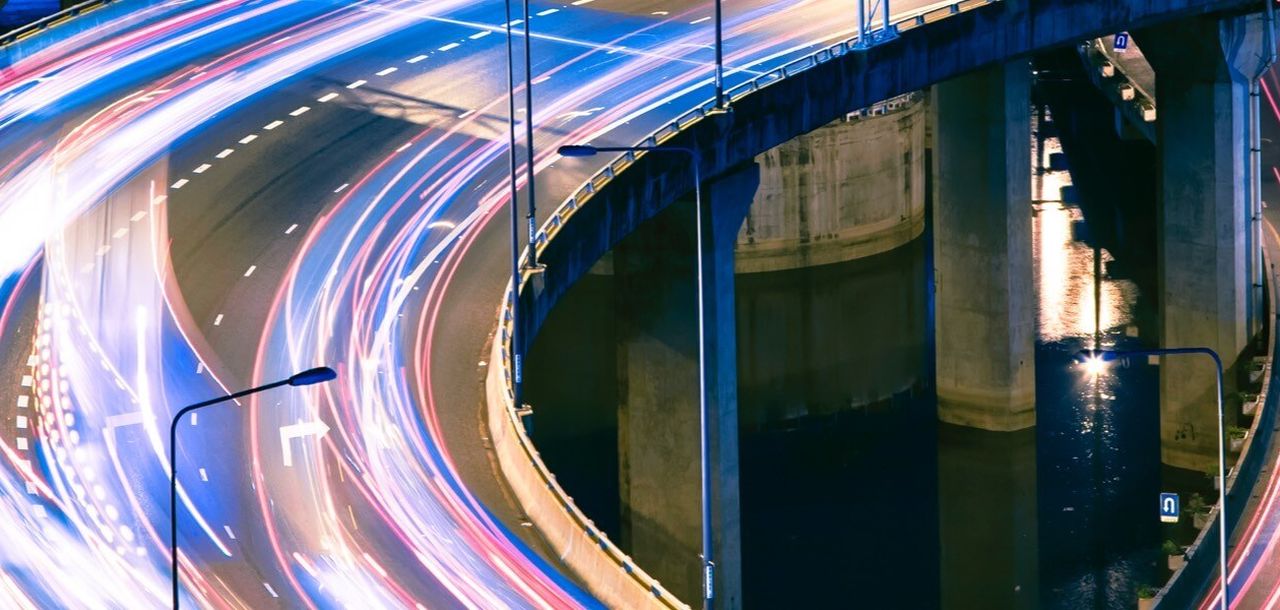 Cars on a bridge with a blurred effect.