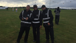 Three marshals pose for a photo